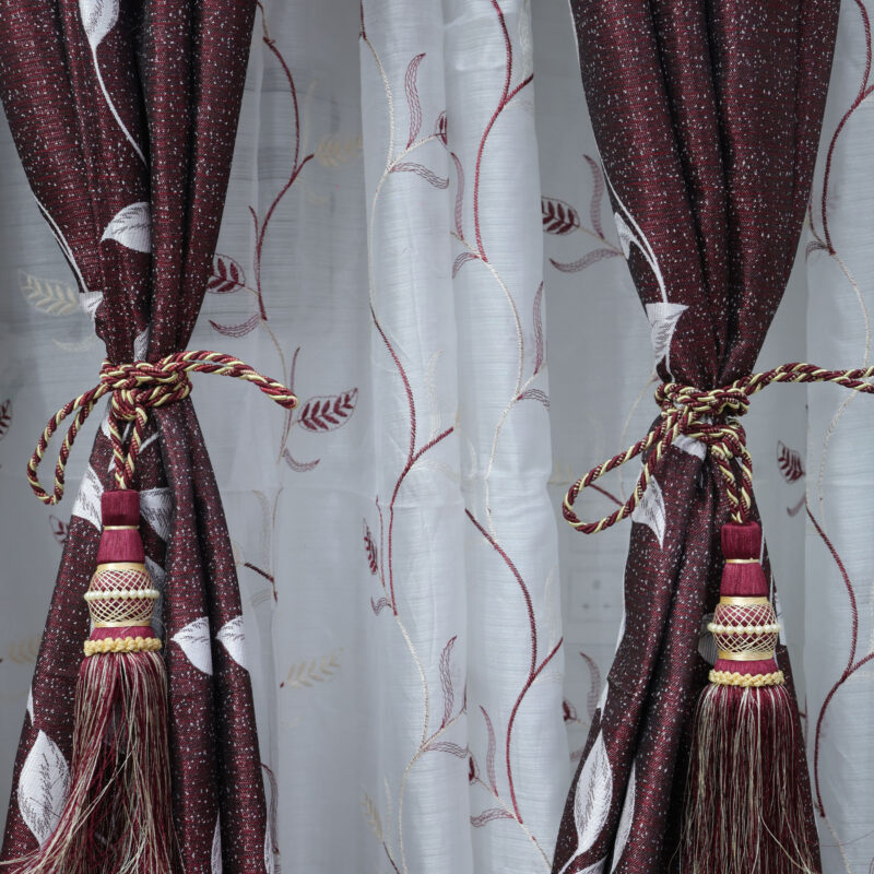 Elegant Maroon and White Leaf-Patterned Curtains with Decorative Tassel Tiebacks